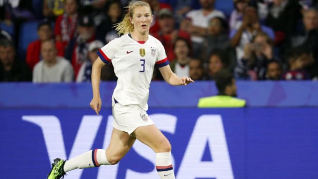 USWNT midfielder Sam Mewis jogs in a World Cup match.